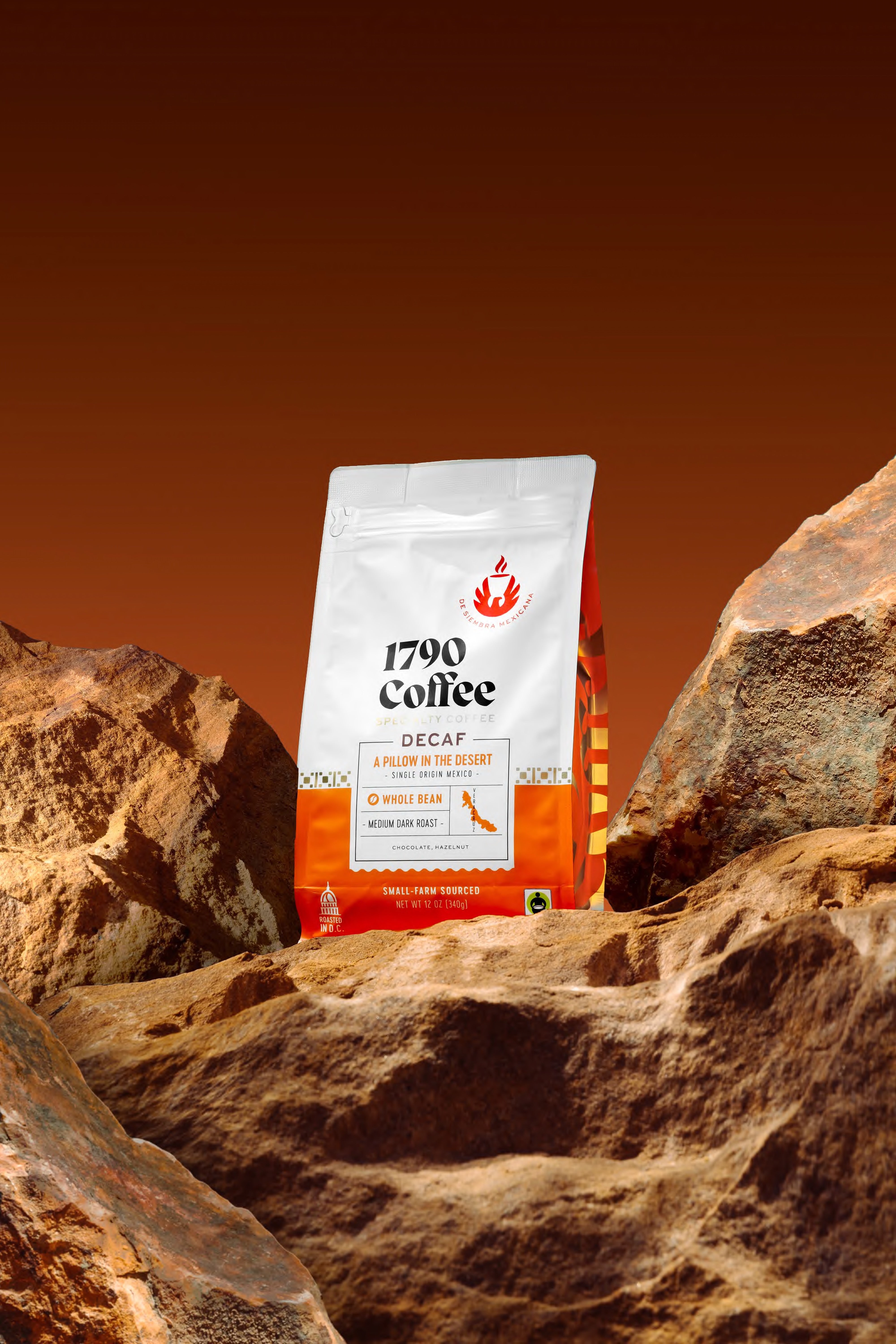 Bag of 1790 Coffee A Pillow in the Desert decaf on desert rocks with a brown background