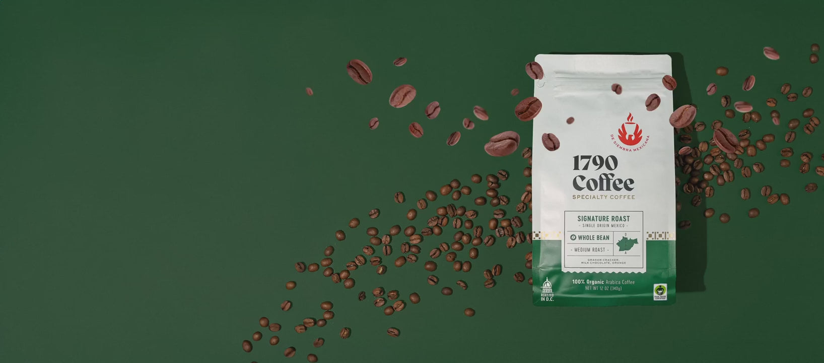 A bag of 1790 Coffee Signature Roast on a green background with some coffee beans moving around it